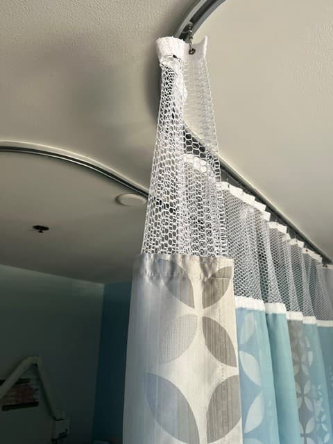 QuickSnap curtain mesh header at the ceiling track